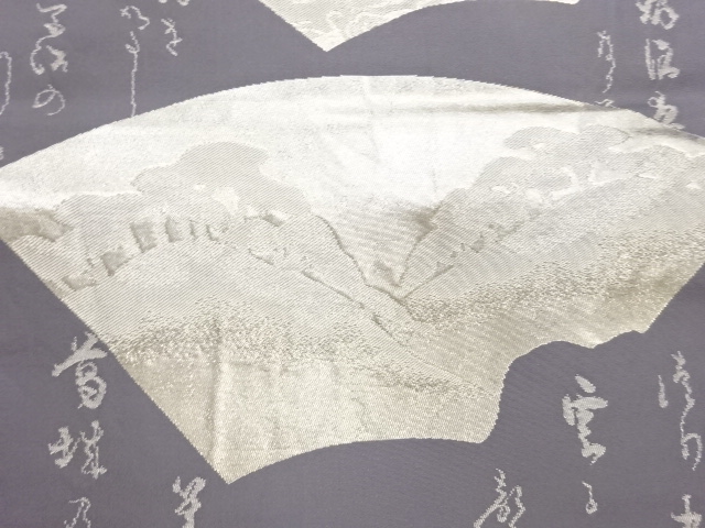  破れ色紙に唐草・山模様織出し袋帯